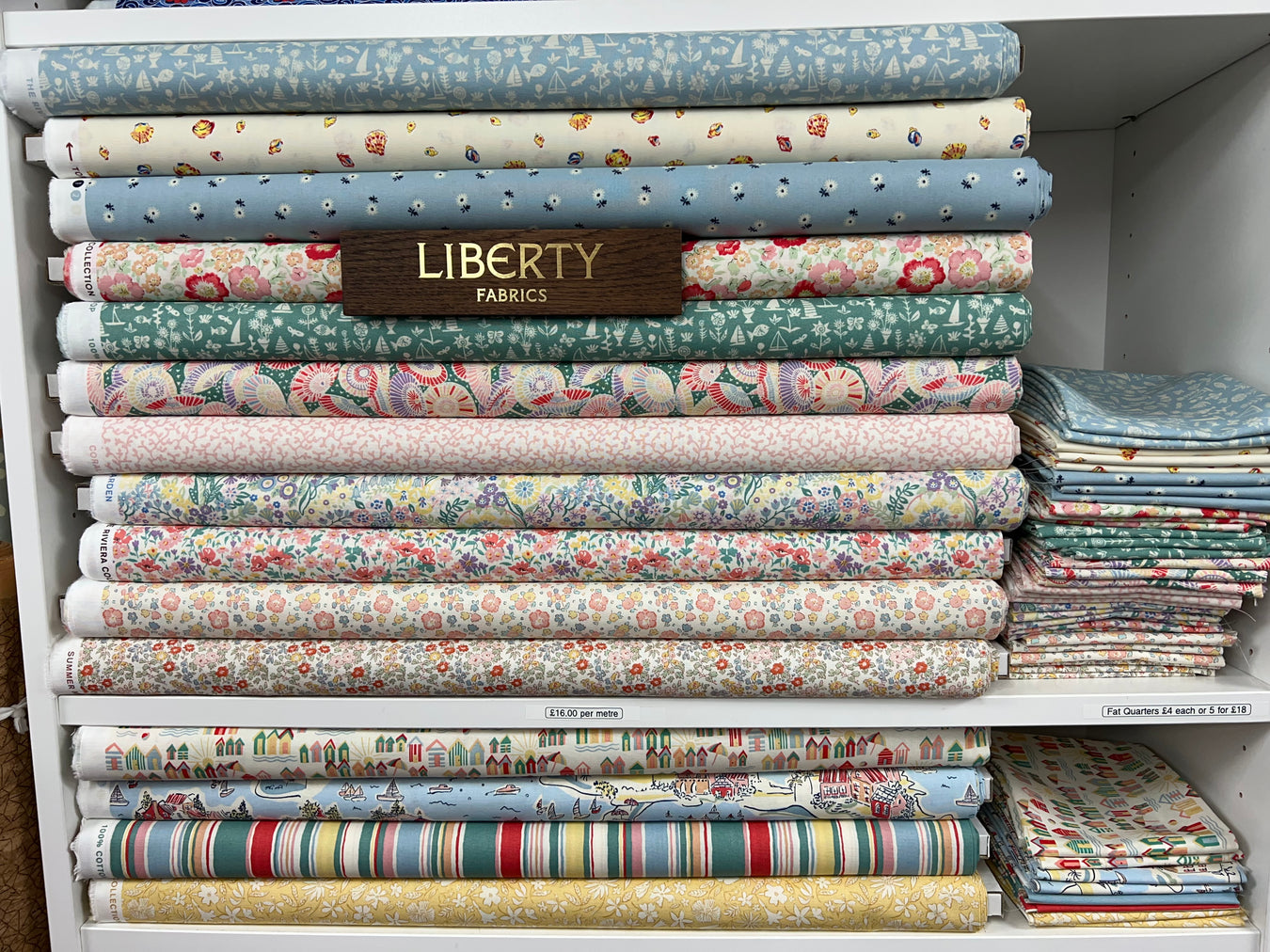 Stack of patterned liberty fabric bolts