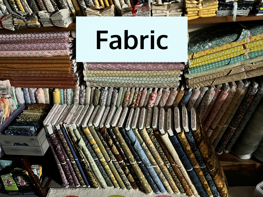 Bolts of Patterned and Plain Fabric